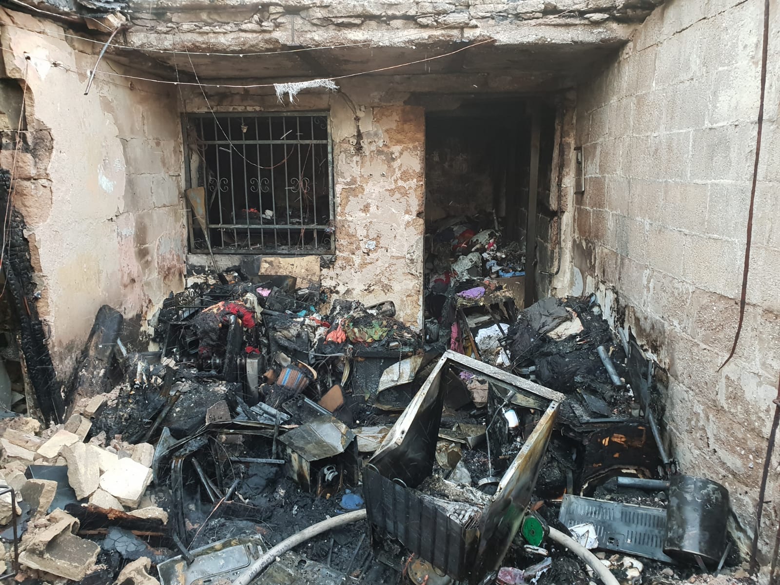 הבית שהוצת בשוק הכרמל - צילום כב"ה דן