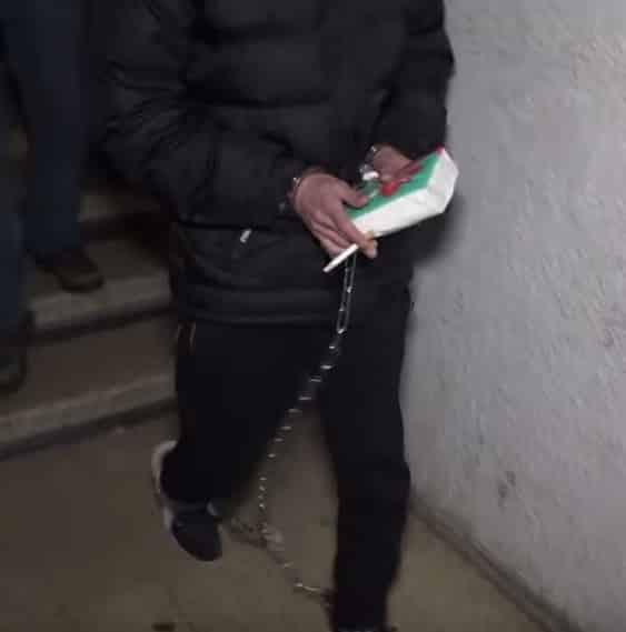 אחד הנאשמים בפרשה לאחר מעצרו