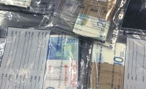 חשד: שדדו באיומי אקדח 68 אלף שקל מאישה